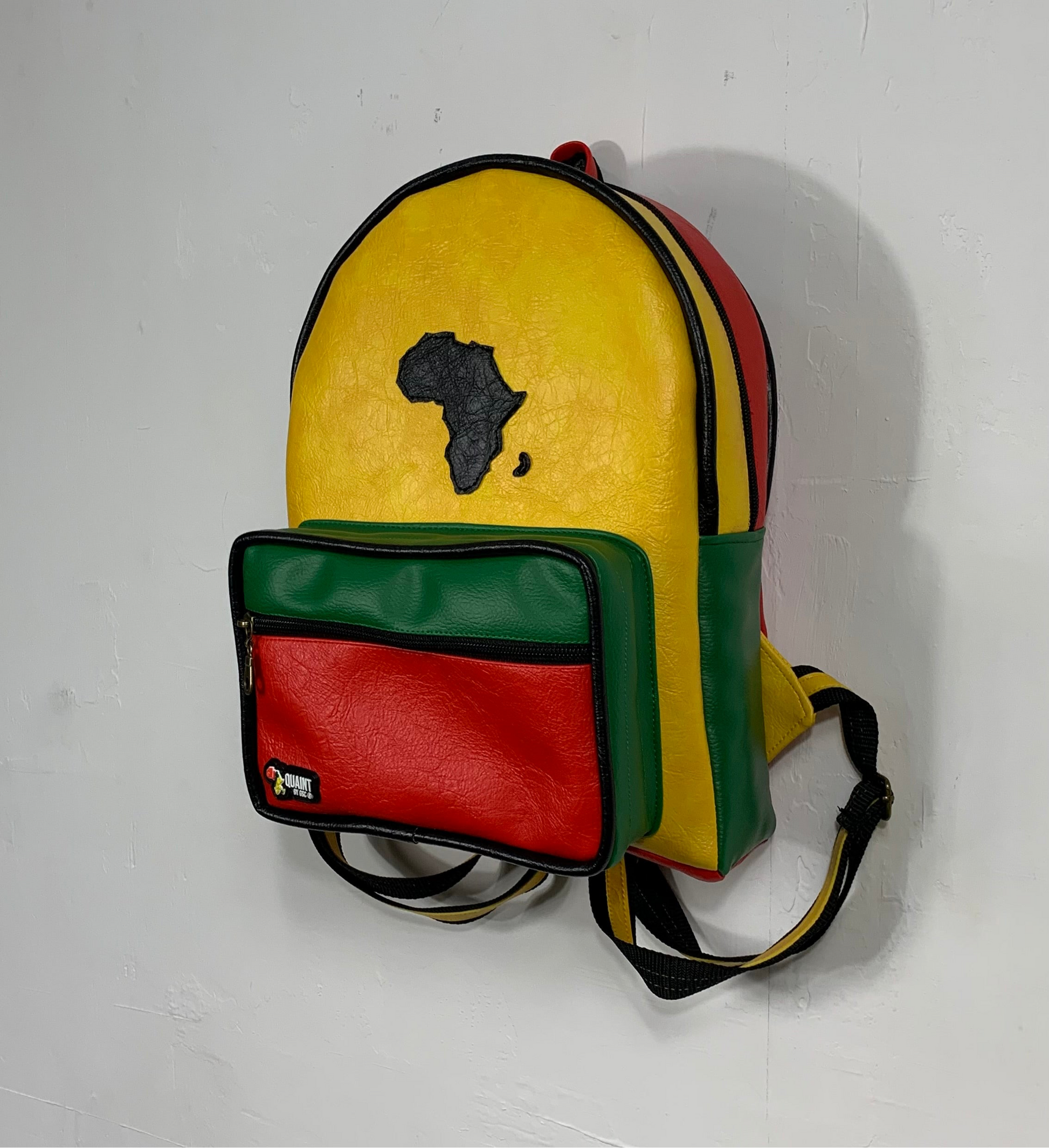 slow fashion clothes, ethical fashion, handmade fashion, backpack, book bag, handmade backpack, reggae backpack, leatherette bag, bag made in jamaica, caribbean products, sew quaint, quaint bags 
